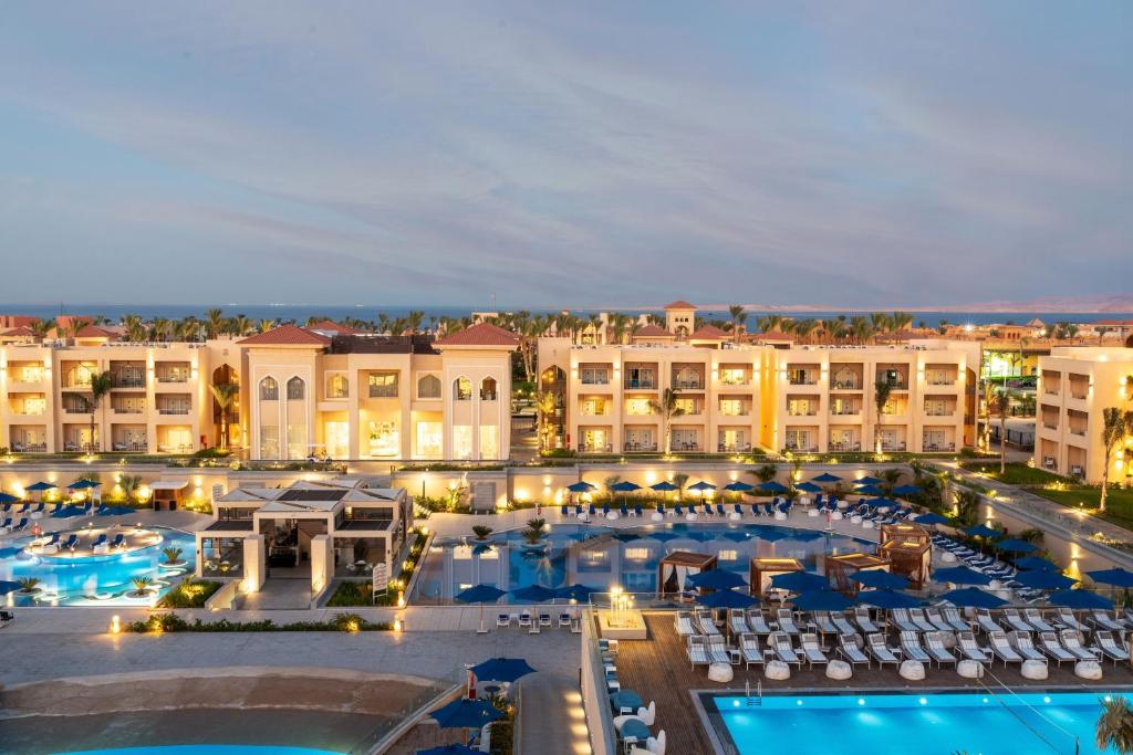 an aerial view of a hotel with a pool and buildings at Cleopatra Luxury Resort Sharm - Adults Only 16 years plus in Sharm El Sheikh