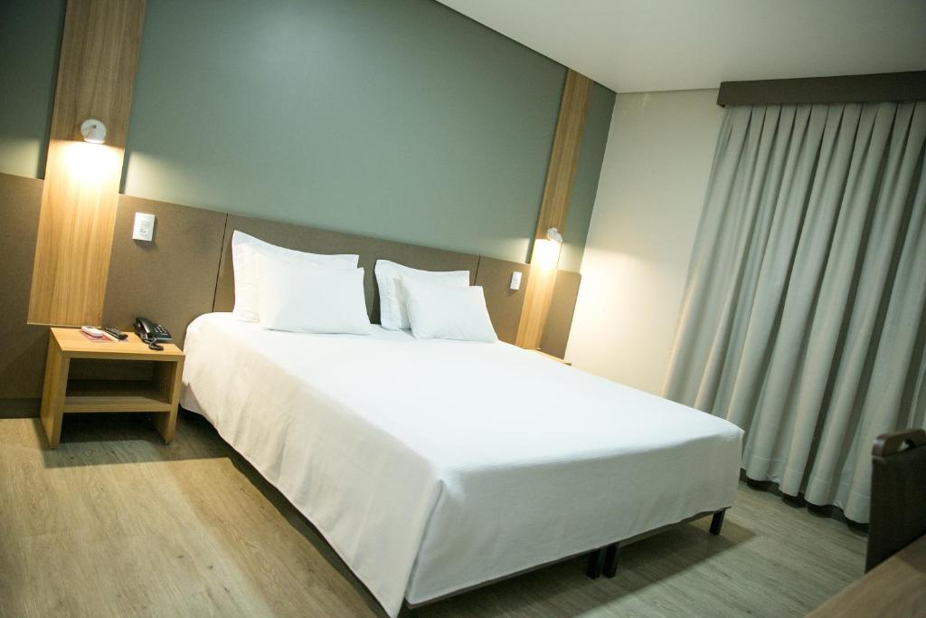 Postel nebo postele na pokoji v ubytování Bello Hotel