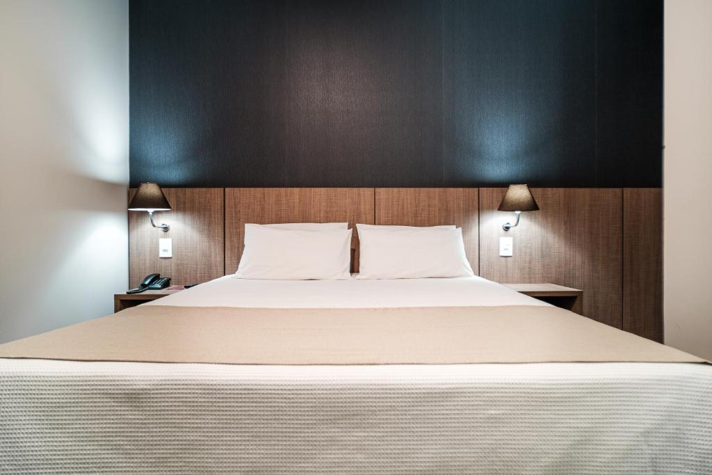 Postel nebo postele na pokoji v ubytování Bello Hotel