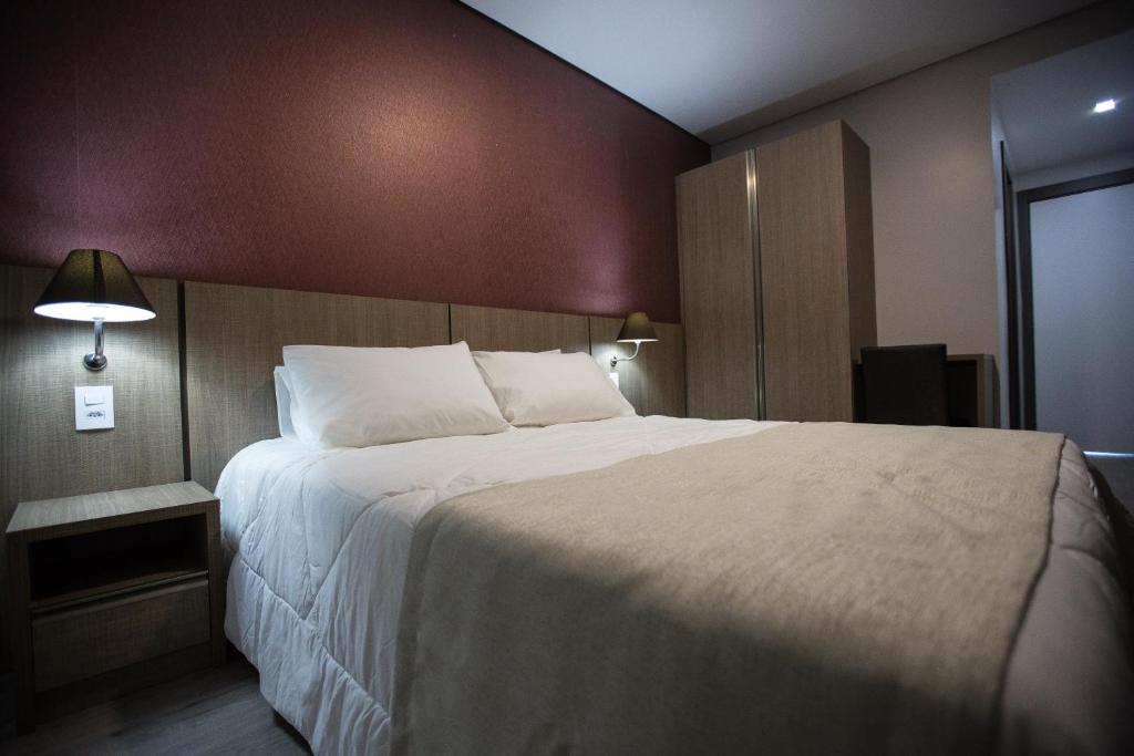 Postel nebo postele na pokoji v ubytování Bello Hotel