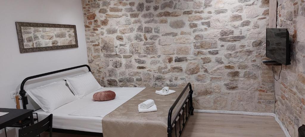 Postel nebo postele na pokoji v ubytování APARTMAN B