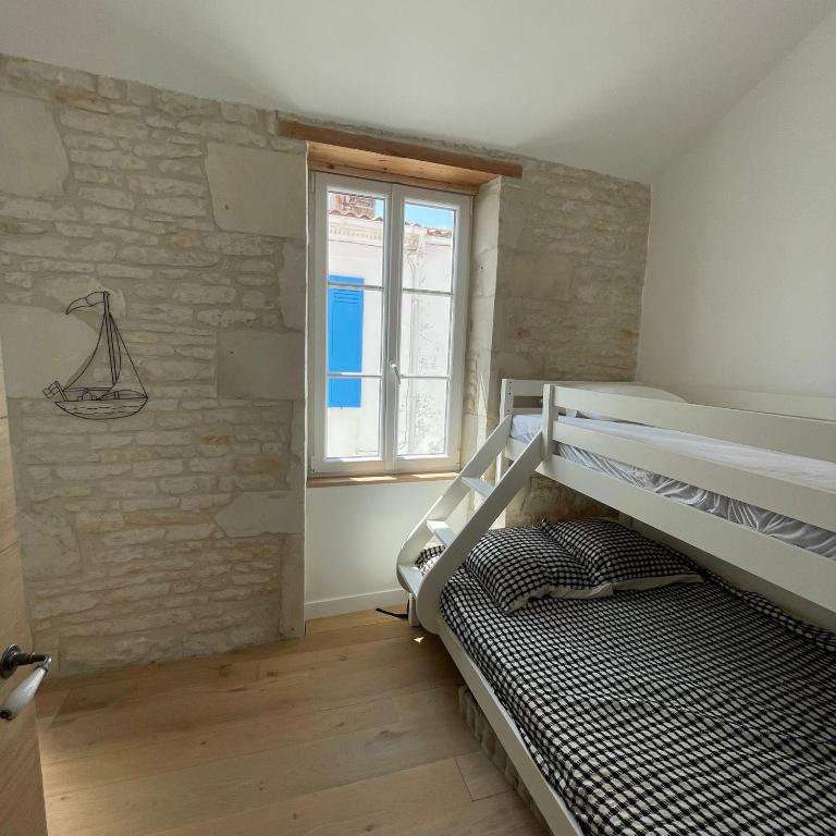Postel nebo postele na pokoji v ubytování L'OCEAN a Oleron