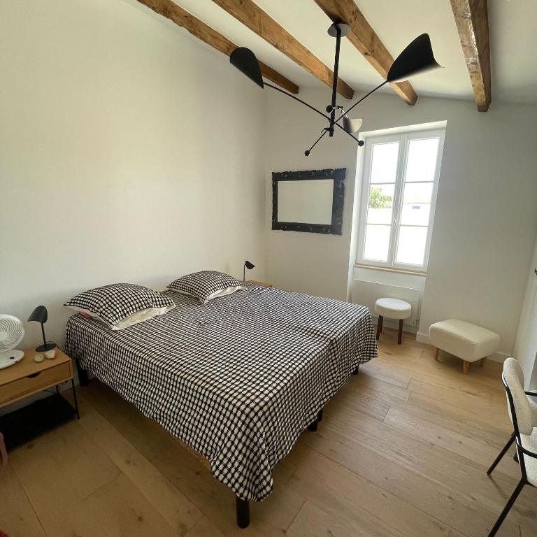 Postel nebo postele na pokoji v ubytování L'OCEAN a Oleron