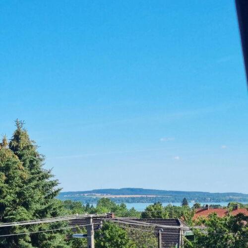 a clear blue sky with trees and a bridge at ANCIENT HOUSE in Vonyarcvashegy