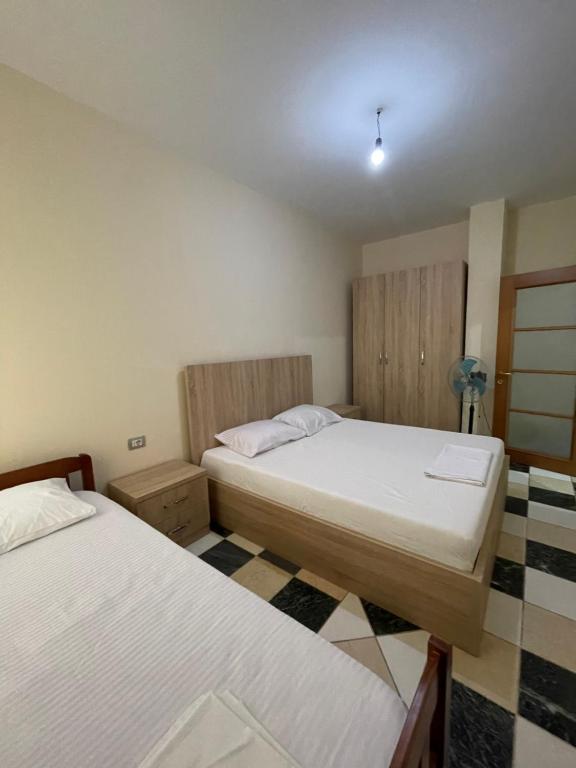Postel nebo postele na pokoji v ubytování Bajovah Apartments & Restaurant