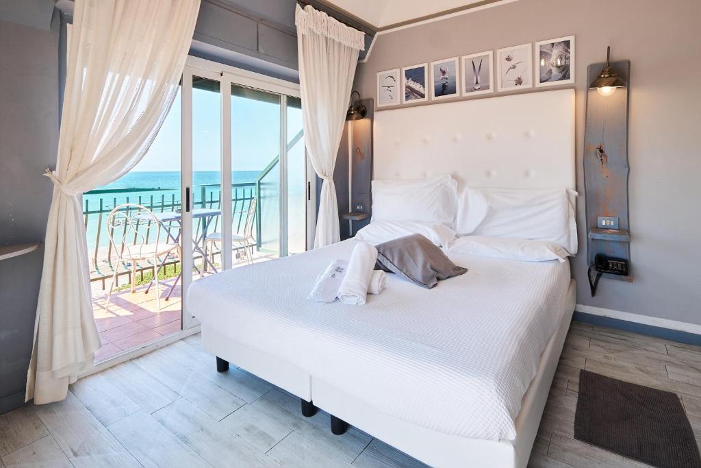 Postel nebo postele na pokoji v ubytování Hotel Zia Piera