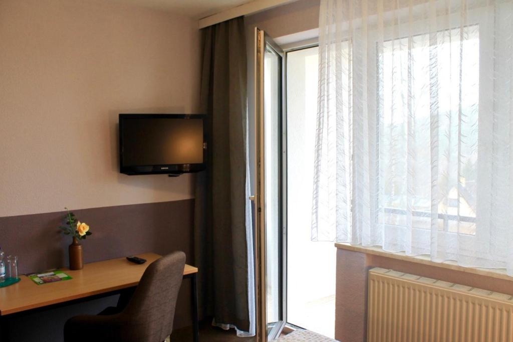 TV a/nebo společenská místnost v ubytování Hotel Carolaruh