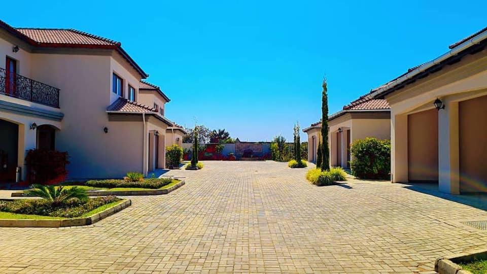 a cobblestone driveway in the middle of a house at 24 Roma in Lusaka
