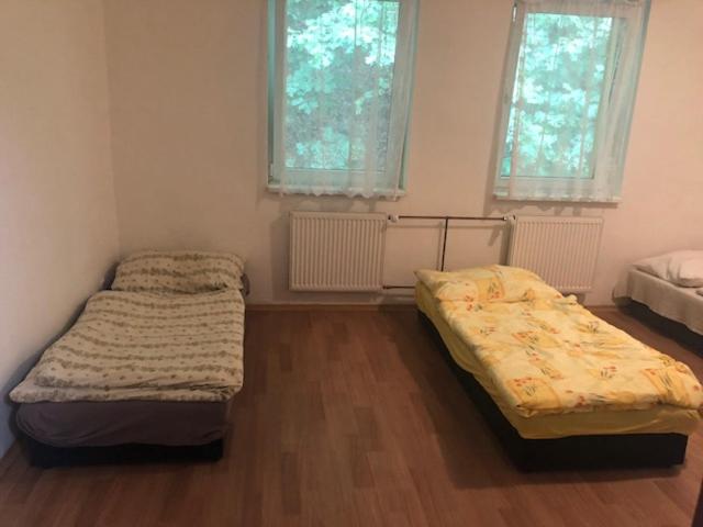 a bedroom with two beds in a room at UBYTOVNA SK Posázavan Poříčí nad Sázavou in Poříčí nad Sázavou