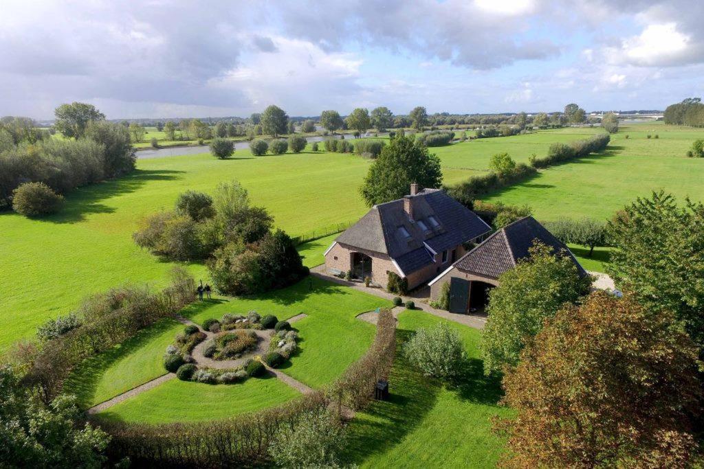 an aerial view of a house in a field at The nicest farmhouse in Holland! in Epse