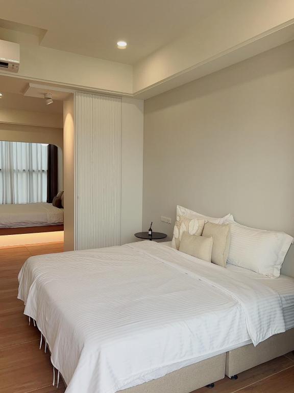 Postel nebo postele na pokoji v ubytování Muzhu B&B