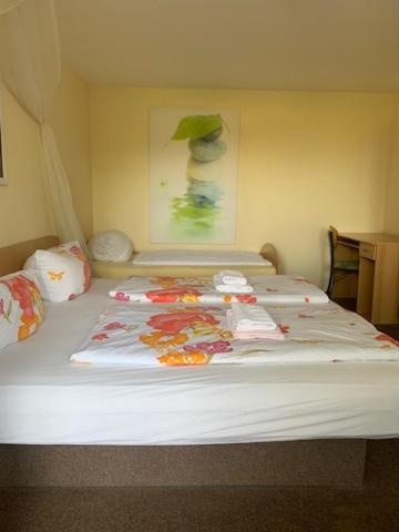 Postel nebo postele na pokoji v ubytování Hotel Carolaruh
