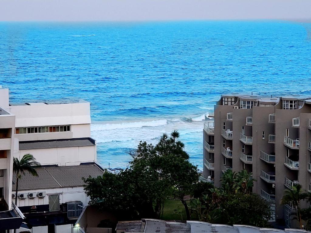 an aerial view of the ocean and some buildings at KimOcean La Ballito Apartment in Ballito