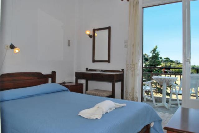 Postel nebo postele na pokoji v ubytování Artemon Hotel