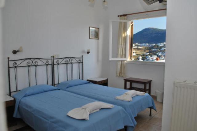 Postel nebo postele na pokoji v ubytování Artemon Hotel