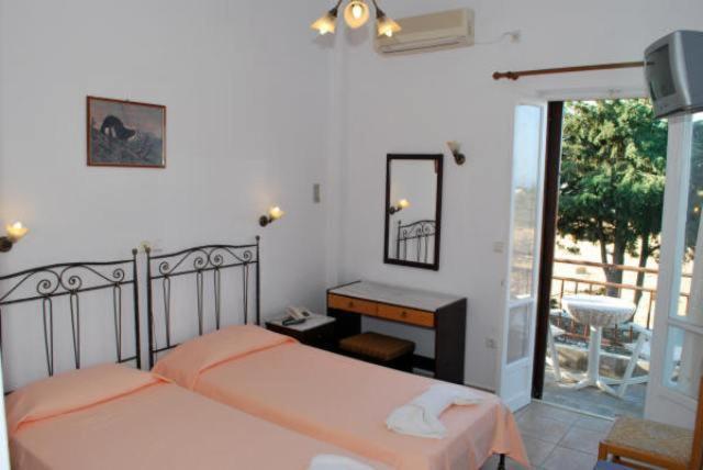 Postel nebo postele na pokoji v ubytování Artemon Hotel