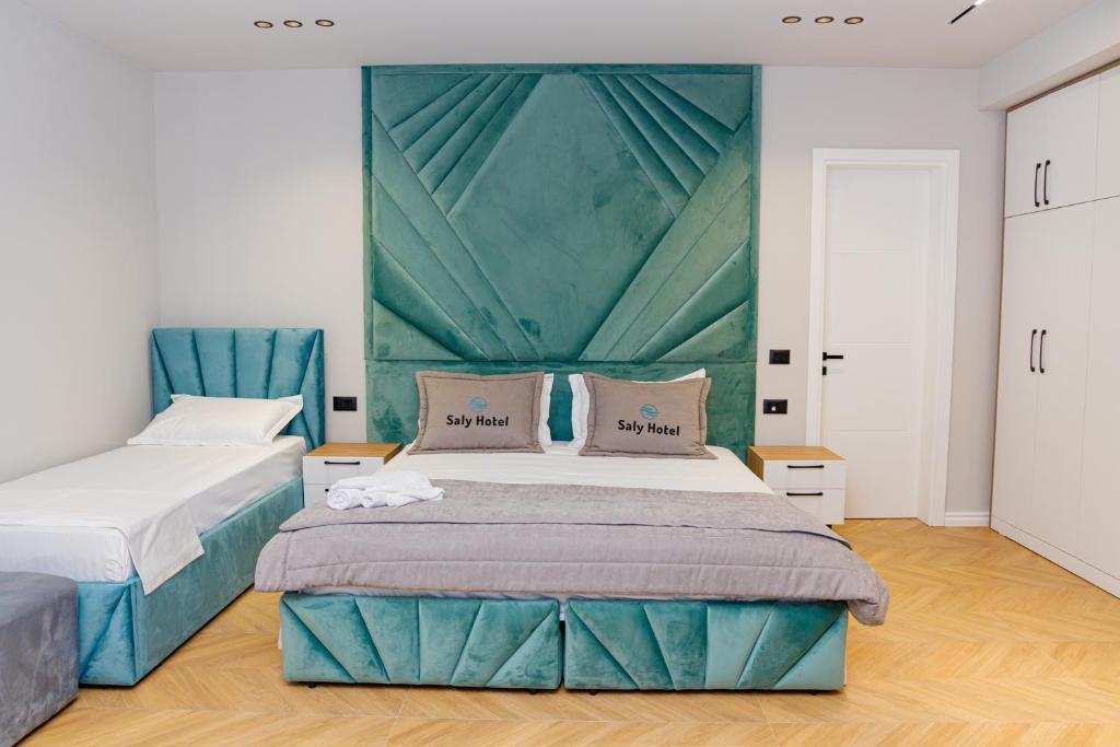 Postel nebo postele na pokoji v ubytování Hotel Saly