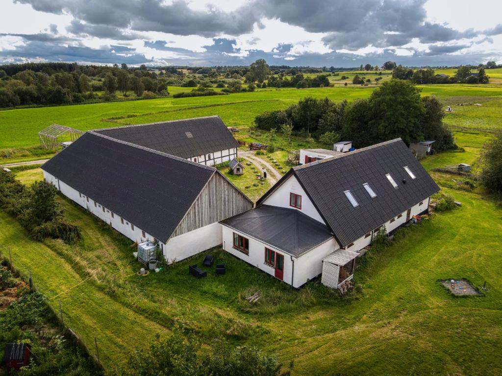 an aerial view of a farm with two barns at Vinkelgaard in Ringsted