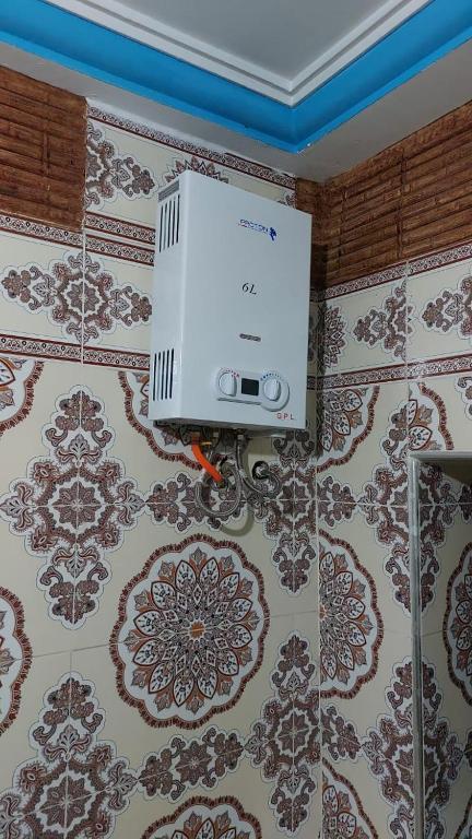 a air conditioner on the wall of a room at taghazout agadir appartement familiale in Taghazout