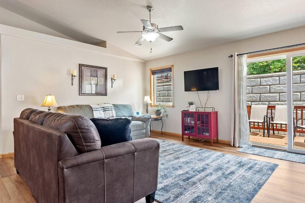 a living room with a couch and a tv at Convenient Townhouse - Near Airport in Rapid City
