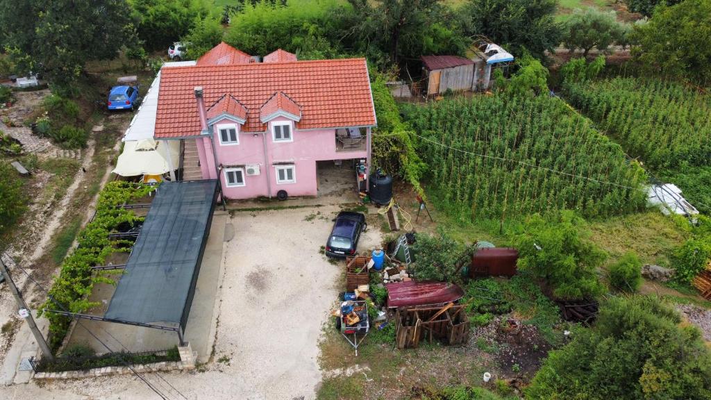 an overhead view of a pink house in a vineyard at Apartman Balsa in Kotor