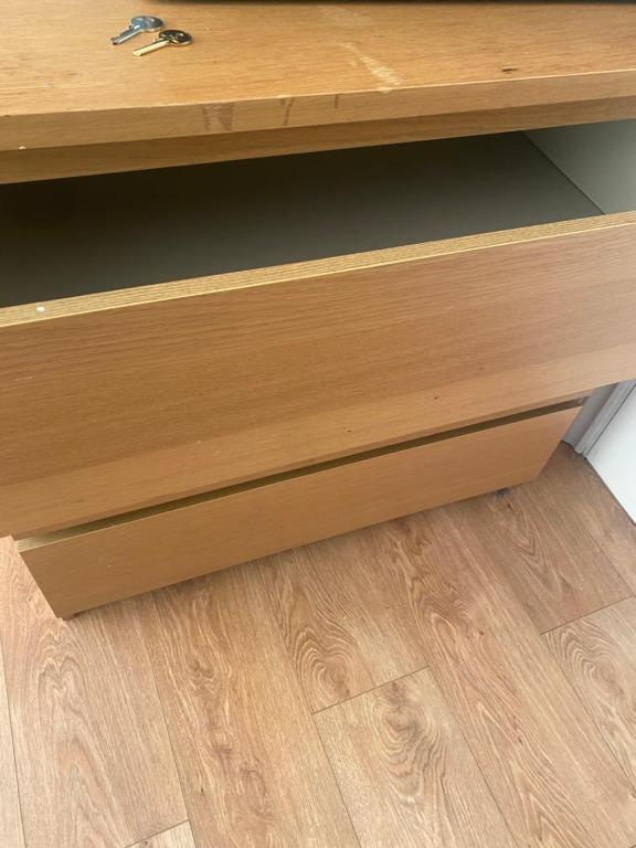 a wooden desk sitting on top of a wooden floor at IServe in Parkside