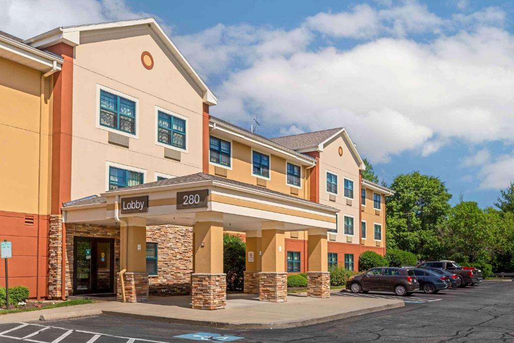 a hotel with cars parked in a parking lot at Extended Stay America Suites - Foxboro - Norton in Norton