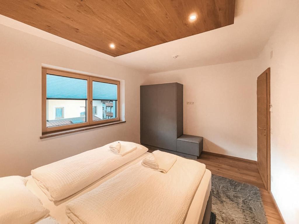 Posteľ alebo postele v izbe v ubytovaní RUHESTUBE - Balcony und Car Park by AlpenLuxus Appartements