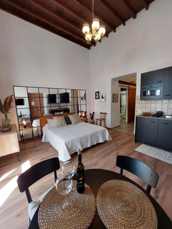 a bedroom with a bed and a table and chairs at Apartamentos La Florida in Arrecife