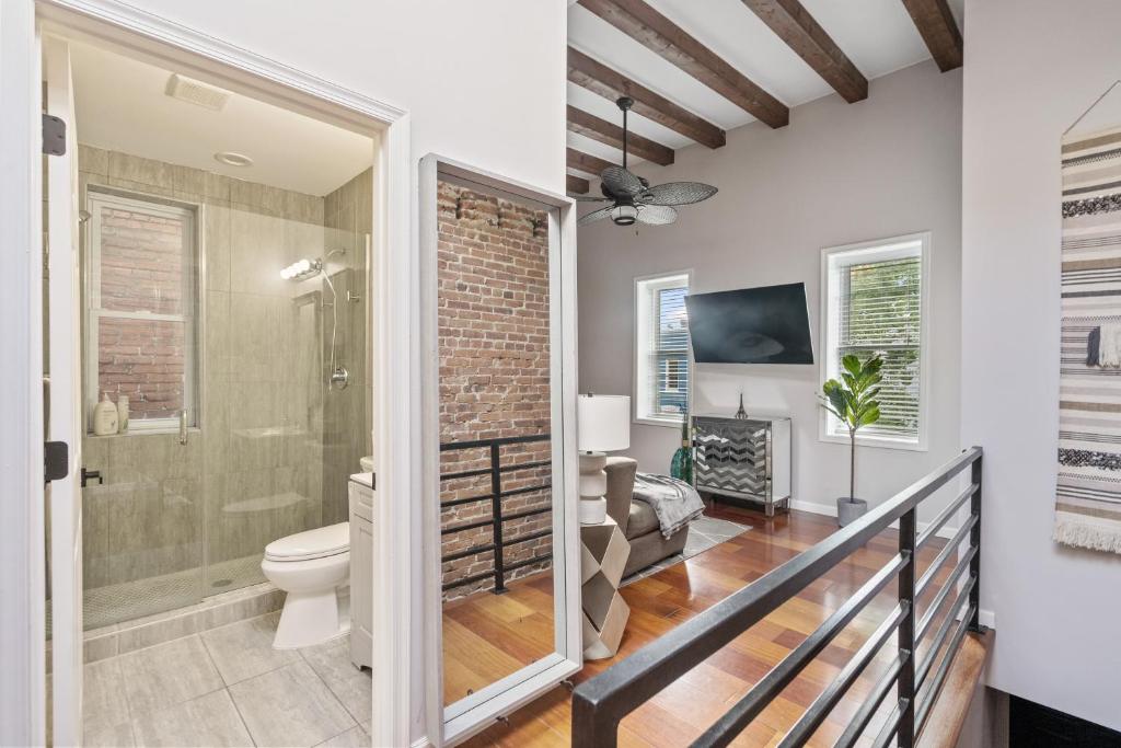 a bathroom with a walk in shower and a toilet at Perfect Location! Stylish Condo Steps Away from Nationals Stadium and Navy Yard in DC's Southwest Gem in Washington, D.C.