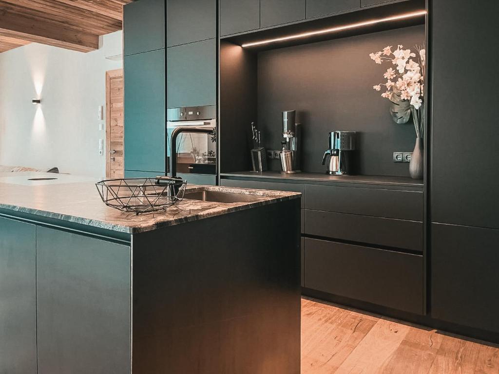 A kitchen or kitchenette at CLOUD 9 - Private Roof Terrace with Whirlpool by AlpenLuxus Appartements