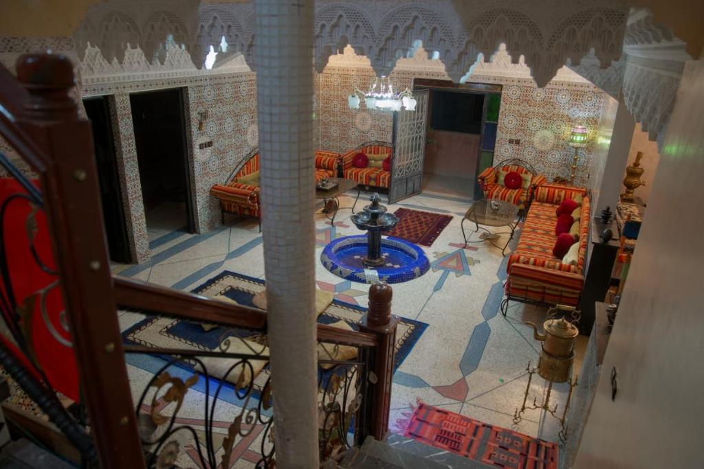 an aerial view of a living room with a fireplace at Riad Dar Fadma in Ouarzazate