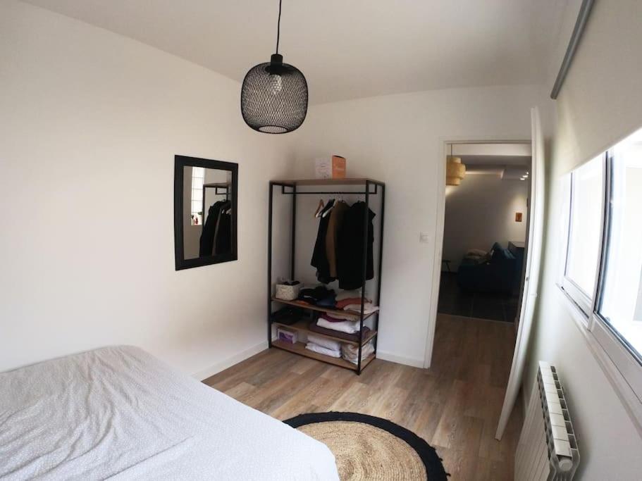 a bedroom with a white bed and a mirror at bnbgônes -LE COSY CRAPONNOIS- Craponne Centre - Proche Lyon - Wifi in Craponne