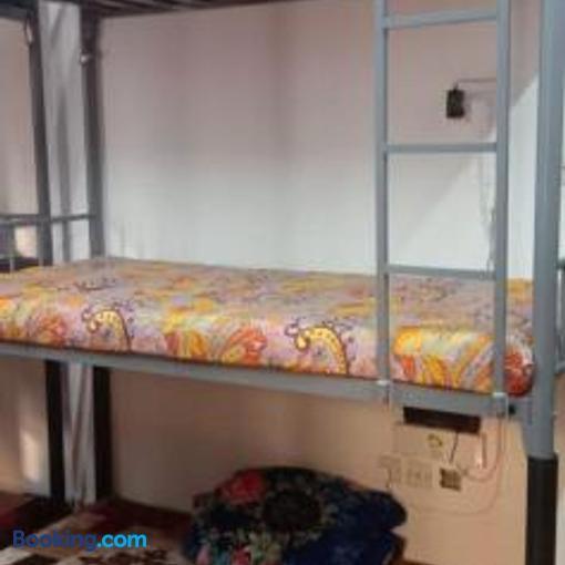 a couple of bunk beds in a room at Making friends with guests in Sharjah