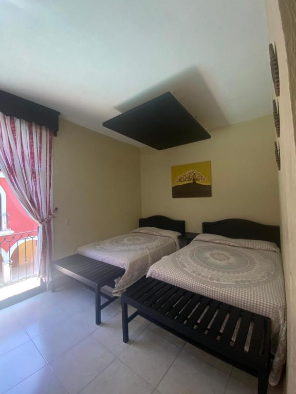 Postel nebo postele na pokoji v ubytování HOTEL TIBERIADES