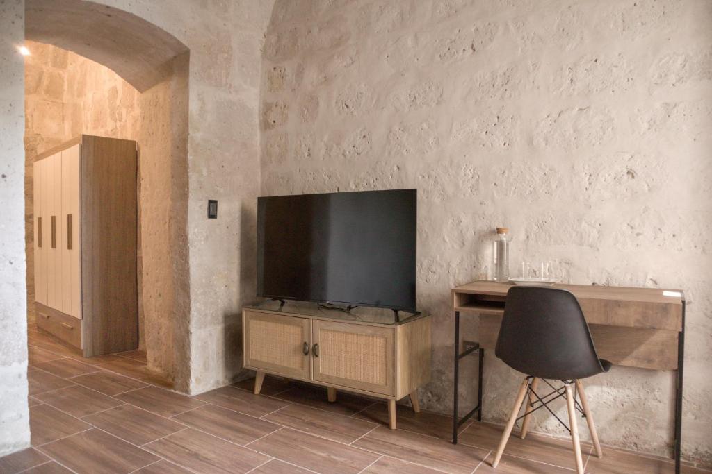TV a/nebo společenská místnost v ubytování Estancia El Solar