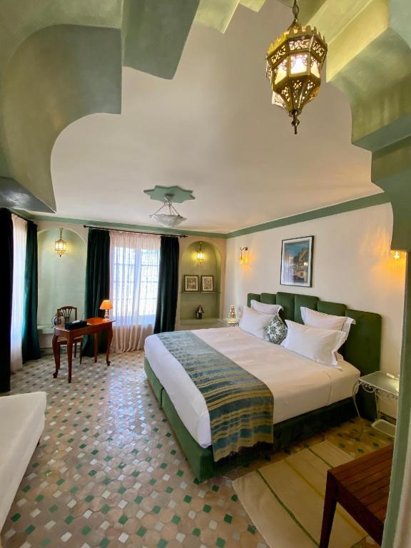 Postel nebo postele na pokoji v ubytování Riad Zamane Fès - Boutique & Spa