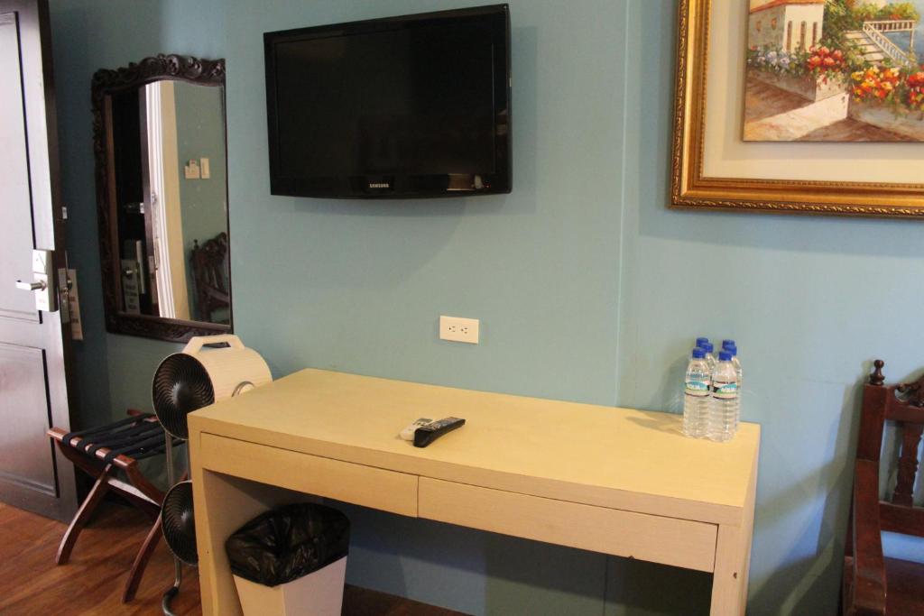 TV a/nebo společenská místnost v ubytování Ciudad Fernandina Hotel
