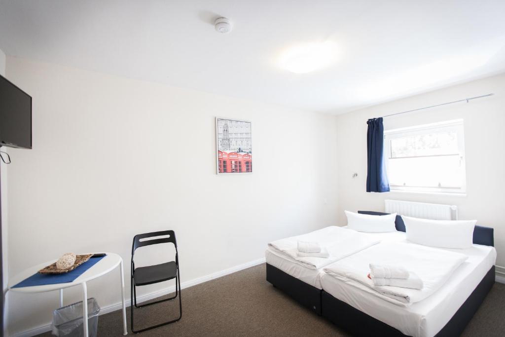 Una cama o camas en una habitación de Arcade Hotel & Hostel Hamburg