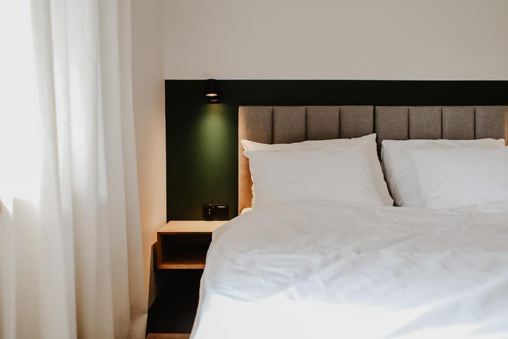 Postel nebo postele na pokoji v ubytování JANOWE miejsce spotkań