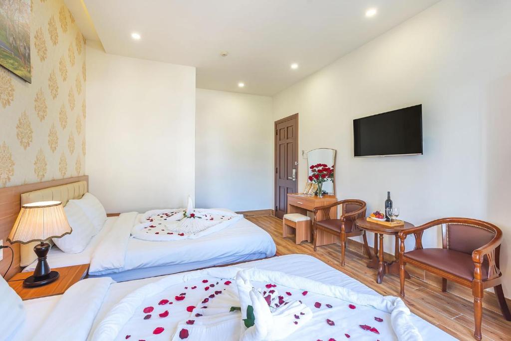 Giường trong phòng chung tại Villa Hoa Ly Đà Lạt