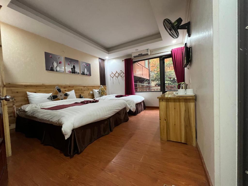 Postel nebo postele na pokoji v ubytování Dang Khoa Homestay