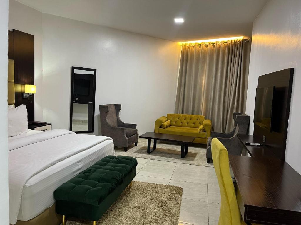 Voodi või voodid majutusasutuse Rollace Hotel toas