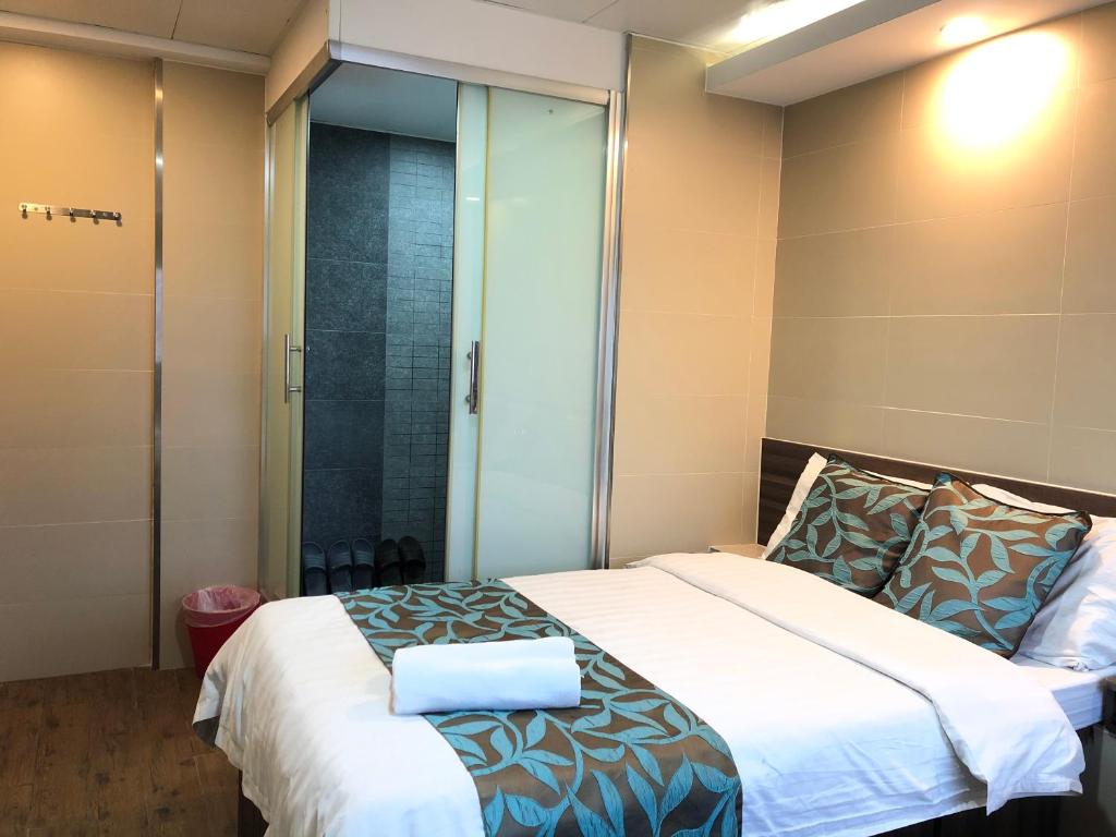 Postel nebo postele na pokoji v ubytování 香港星星旅馆 2202 Guesthouse