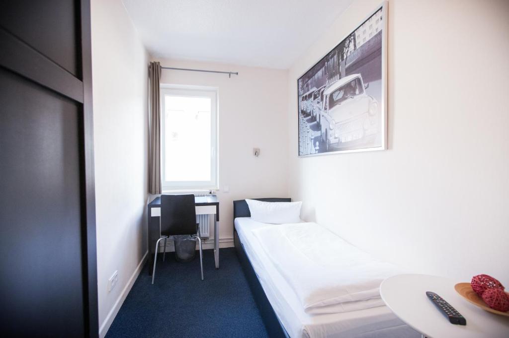 Una cama o camas en una habitación de Arcade Hotel & Hostel Hamburg