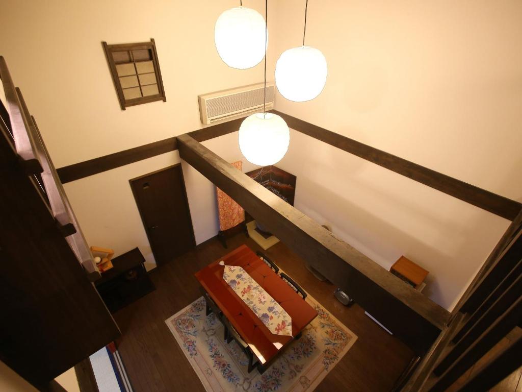 an overhead view of a staircase with a table and lights at Kisoji no Yado Iwaya in Kiso