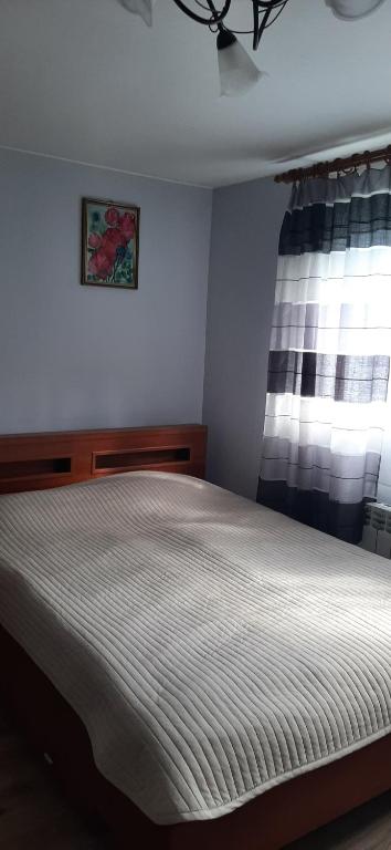 Posteľ alebo postele v izbe v ubytovaní Domek - Leśna Kryjówka