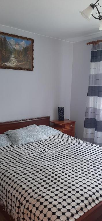 Posteľ alebo postele v izbe v ubytovaní Domek - Leśna Kryjówka