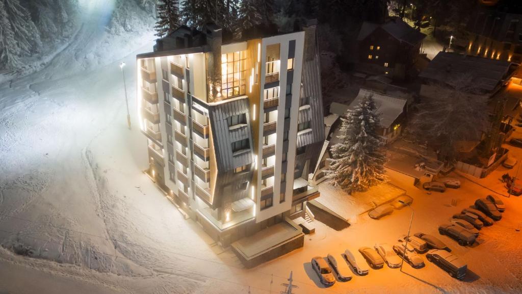 an overhead view of a building in the snow at night at Aparthotel Poljice in Jahorina