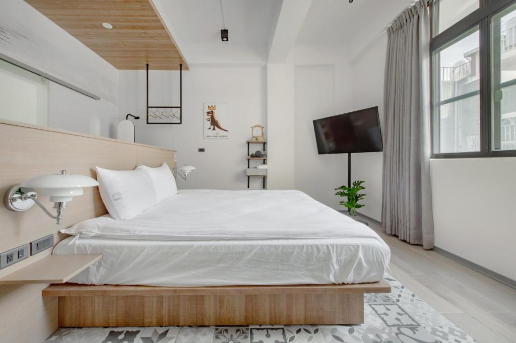 Uma cama ou camas num quarto em Long Stay Here